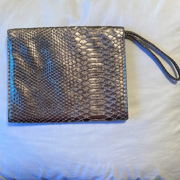 Neiman Marcus wristlet. Silver. Shine pulls bronze or gray depending. 9.5”x5.5” - Picture 2 of 8
